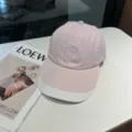 Detailed close-up of pink and white baseball cap showing fabric texture and embroidery. - 55-59 / Pink