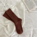 Cozy brown cable knit mid-calf socks for women, thick and warm winter hosiery essential. - One Size / Caramel - Cable Knit Pattern