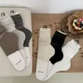 Detailed view of women knitted slouch leg warmers, soft texture, aesthetic daily sock styling. - One Size / Black