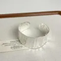 Wide open cuff bracelet detail view, textured silver metallic finish minimalist design jewelry. - Wave Texture Style (Y-203)