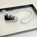 Rhinestone canvas shoe pendant necklace detail, sparkling crystal charm with long woven rope. - Black Shoes with White Laces Z-2890
