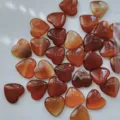 Polished natural red carnelian heart-shaped stones for romantic Valentine's Day decor - Red Agate