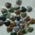 Polished heart-shaped natural crystal stones in various mixed earthy colors for decor - India Agate