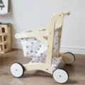Wooden toy shopping cart detail showing natural wood frame and grey star fabric basket. - Simulation Shopping Cart - Left