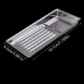 Stainless steel disinfection tray detail showing perforated draining slots and compact tool compartment. - Silver
