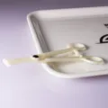 Disposable plastic body piercing clamp tool for professional body piercing studio use. - Disposable Slanted Forceps