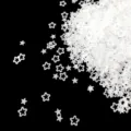Macro detail of translucent matte frosted star sequins for nail art and DIY craft design. - 15g Bag / White