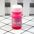 Detail shot of 10g pink color essence bottle for UV resin and epoxy resin craft dyeing. - Pink