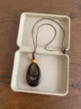 Close-up detail of the retro wooden beaded necklace with geometric pendant in a simple box. - Brown Double Waterdrop Style (XL5537E)