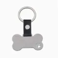 Porte-clés en os en acier inoxydable avec patte creuse, lanière en cuir pour animaux. - Patte Chien Ajourée Cuir Os Argent