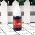 Detailed view of 10g red color essence pigment for DIY UV epoxy resin crystal craft making. - 10g/Piece / Bright Red