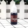 Close-up of 10g red brown resin pigment dye, high concentration oily UV epoxy colorant. - 10g/Piece / Red Brown
