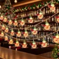 Detailed scene of Christmas snowman string lights hanging indoors, warm glowing festive decor. - 1.5m 10LED Battery