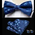 Detail view of blue jacquard floral bow tie, pocket square and cufflink set for formal wear. - JP167