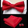 Detailed view of elegant red jacquard bow tie, pocket square, and matching cufflinks set. - JP179