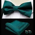 Detailed view of dark green houndstooth bow tie, pocket square and cufflinks set. - JP186