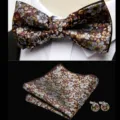 Detailed view of floral jacquard bow tie, pocket square and matching cufflinks set texture. - JP192