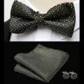 Detail view of men's black jacquard bow tie, matching pocket square, and cufflinks set. - JP201 Black Gold Jacquard