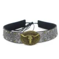 Vintage bull head hat band detailed close-up, retro metallic embossed cowboy hat accessory style. - Size 11