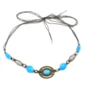 Detailed view of vintage bohemian hat band with blue stones, metal beads, and brown cord. - 16#
