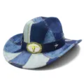 Close-up detail of vintage denim western cowboy hat with metal bull skull buckle and stars. - Flat Top A / One Size