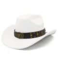 Close-up of the white suede cowboy hat featuring a detailed bronze bull skull buckle and rivets. - White