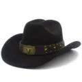 Close-up of dark brown suede cowboy hat with leather band, metal studs and bull skull buckle. - Black