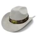 Detailed view of grey suede western cowboy hat with brown leather band and metal bull skull decor. - One Size / Gray