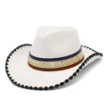 Detailed view of white western cowboy hat with star rivets and patterned hatband close-up. - One Size / White