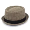 Plaid jazz hat detail showcasing the classic brown woven pattern and black ribbon band. - One Size / Khaki