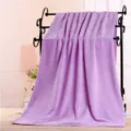 Large microfiber bath towel in light purple, displayed on a rack for home and salon use. - Light Purple