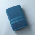 Thick pure cotton blue bath towel, soft and absorbent, perfect for daily dorm use. - Blue