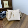 Chic straw woven crossbody bag for women, stylish summer shoulder handbag with pearl pendant. - Cat Head Apricot