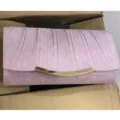 Close-up detail of a sparkling pink glitter evening clutch bag with elegant metal lock hardware. - TW020 Pink