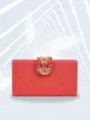Close-up detail of a stunning red sparkly evening clutch featuring an exquisite ruby crystal clasp. - TW170H Red