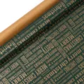 Close-up detail view of green Christmas wrapping paper roll with festive typography design. - Green Background MC