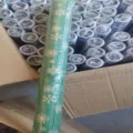 Snowflake gift wrapping paper roll bulk stock for Christmas birthday party packaging details. - Green Background Snowflakes