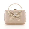 Elegante goldene Glitzer-Abendtasche mit funkelnder Strass-Schleife und rundem Metallgriff. - 2301 Champagner