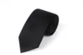 Detail shot of a classic black men tie, rolled neatly, perfect for formal business and suit wear. - L7007 (Solid Black)