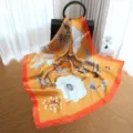 Luxury silk square scarf for women with elegant floral print and vibrant orange border design. - Style SJ122-JKJ