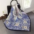Luxurious silk square scarf with elegant blue floral print, smooth and soft styling accessory. - Style SJ128-JKJ
