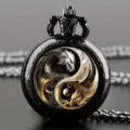 Vintage quartz pocket watch with intricate yin yang dragon design and metal chain detail. - Two-Tone Dragon (Black Case)