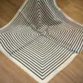 Detail view of a black and white geometric silk square scarf, elegant neck and bag accessory. - SJ1114-JKF