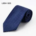 Detailed closeup of the rolled blue business tie featuring subtle geometric square patterns. - L85H-S03