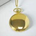 Classic gold tone quartz pocket watch with matching chain, simple vintage design variant. - Gold