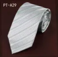 Detailed view of a striped men's formal necktie in light grey and green, rolled up neatly. - PT-A29