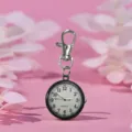Portable quartz nurse pocket watch with keychain clip, black bezel and white dial design. - Black