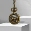 Vintage bronze pocket watch with intricate hollow carved zodiac monkey design and chain for gifts. - Monkey
