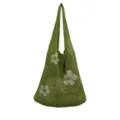 Detailansicht der grünen Strick-Netz-Tasche mit eleganten, beige floralen Webmustern. - Hellgrün