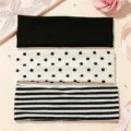 Detail view of elastic headbands featuring solid black, polka dot, and striped patterns for sports. - 3-Pack / Mixed Polka Dots Stripes